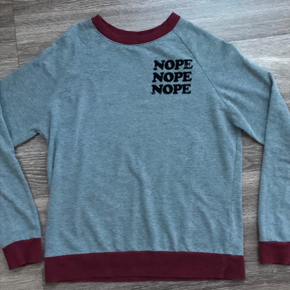 a long sleeve Nope shirt